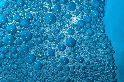 Pattern of soap surf bubbles in blue coloured water 28/12/2008 India Copyr... Stock Photos
