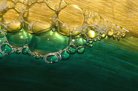 Pattern of soap surf bubbles in coloured water 28/12/2008 India Copyright:... Stock Photos