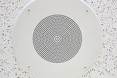 Pattern of a sound speaker on a ceiling tile Stock Photos