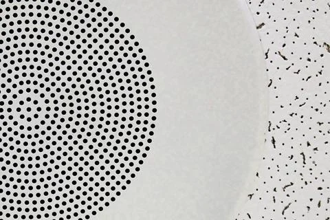 Pattern of a sound speaker on a ceiling tile Stock Photos