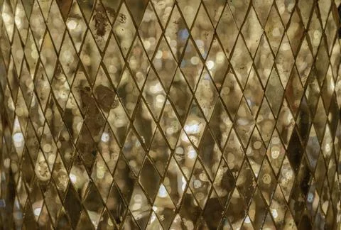 The pattern of Square mirror tiles with Shining golden lighting reflected i.. Stock Photos