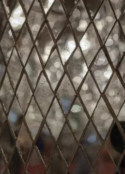 The pattern of Square mirrored tiles with shiny lighting reflected in them... Stock Photos