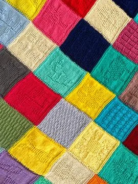 Pattern of squares on a knitted blanket 写真素材