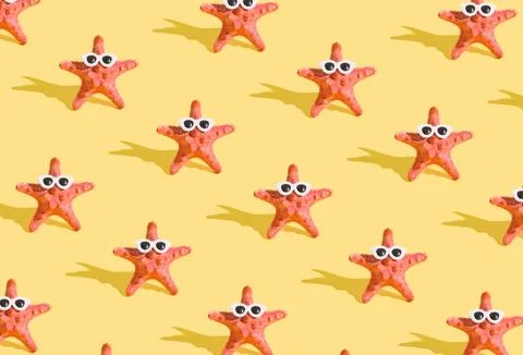 Pattern from starfish in sunglasses on a yellow background. Minimalistic hu.. Stock Photos