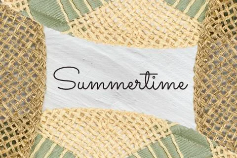 Pattern from straw hats and Summertime text on white textured background Stock Photos