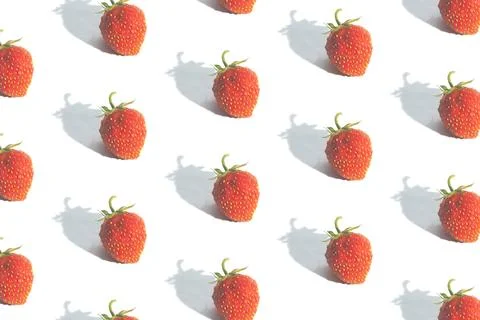 Pattern with strawberries isolated on white. Abstract summer background Stock Photos