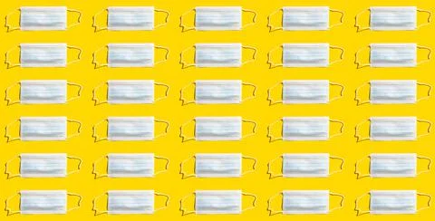 Pattern with surgical fase masks on yellow backround Stock Photos