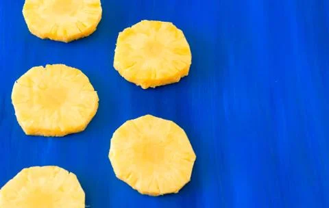 Pattern of Sweet pineapple on blue background top view, flat lay Stock Photos