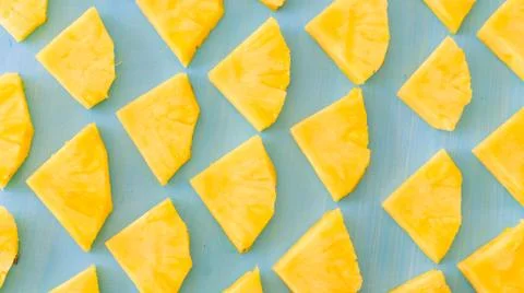 Pattern of Sweet pineapple on blue background top view, flat lay Stock Photos