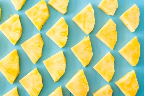 Pattern of Sweet pineapple on blue background top view, flat lay Stock Photos