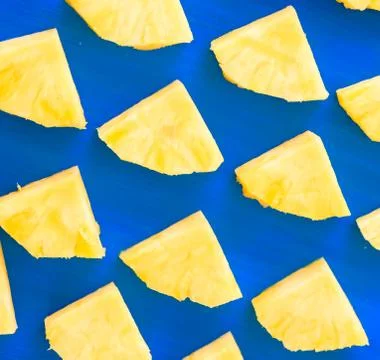 Pattern of Sweet pineapple on blue background top view, flat lay Stock Photos
