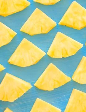 Pattern of Sweet pineapple on blue background top view, flat lay Stock Photos
