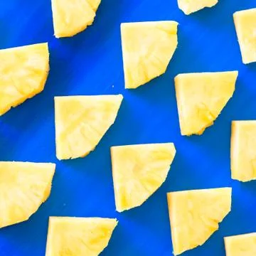 Pattern of Sweet pineapple on blue background top view, flat lay Stock Photos