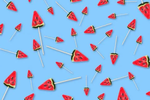 Pattern of sweets in form of watermelon on blue background Stock Photos
