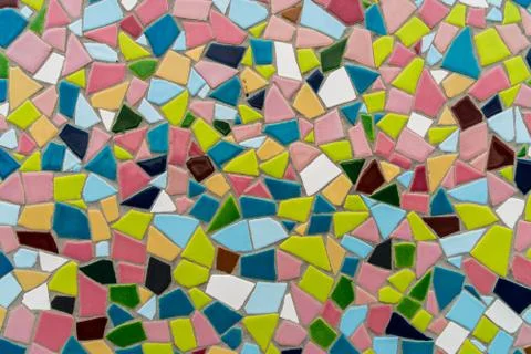 Pattern texture of colorful small mosaic tiles on the wall. Stock Photos