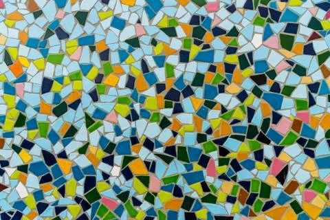 Pattern texture of colorful small mosaic tiles on the wall. Stock Photos
