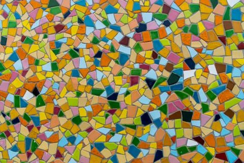 Pattern texture of colorful small mosaic tiles on the wall. Stock Photos