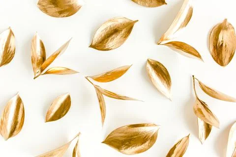 Pattern, texture with gold leaves isolated on white background. flat lay, top Stock Photos