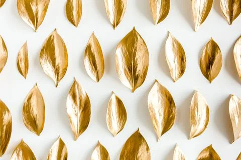 Pattern, texture with gold leaves isolated on white background. flat lay, top Stock Photos