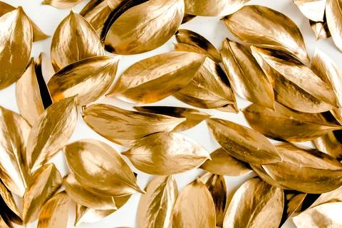 Pattern, texture with gold leaves isolated on white background. flat lay, top Stock Photos