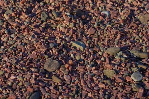 Pattern , texture, red pebbles, coating of stones. Stock Photos