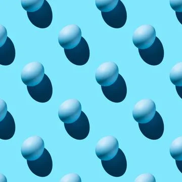 The pattern of their blue eggs with a hard shadow arranged diagonally on a bl Stock-Fotos