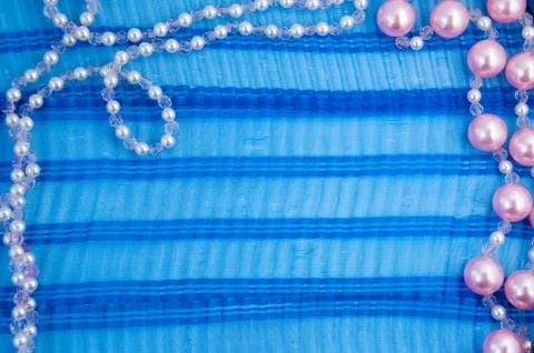Pattern of thread beads on a blue ribbon Foto stock