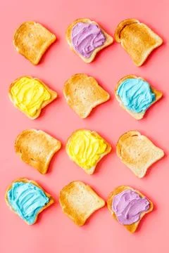 Pattern of toast bread with colored cheese spread. Layout top view Foto stock