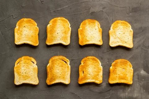 Pattern of toast bread slices. Layout of food, overhead view Stock Photos