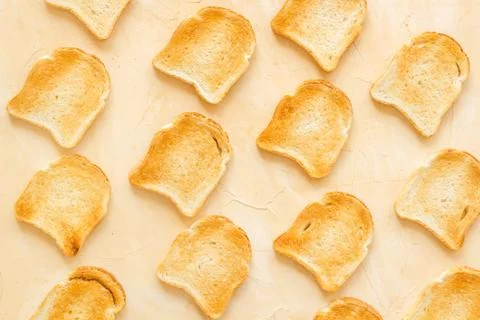 Pattern of toast bread slices. Layout of food, overhead view Stock Photos