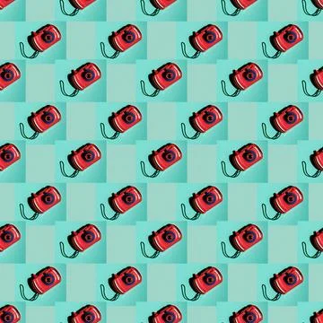 A pattern from a toy camera on a turquoise background. Top view Stock Photos