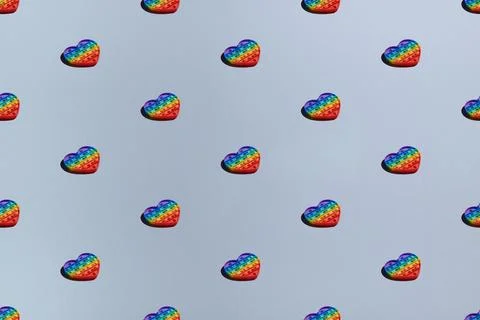 Pattern trendy pop it fidget toy on blue background Stock Photos