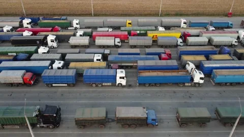 Pattern of trucks waiting in line for unloading at the port. Quadcopter flight Stock Footage 162036215