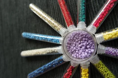 Pattern of tubes with small beads composed in the shape of the sun abstract Stock Photos