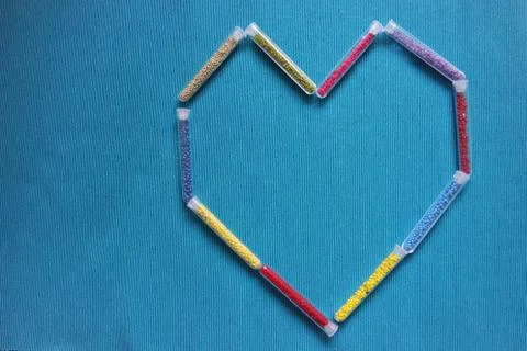 Pattern of tubes with small beads heart Stock Photos