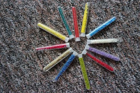 Pattern of tubes with small beads heart flower Stock Photos