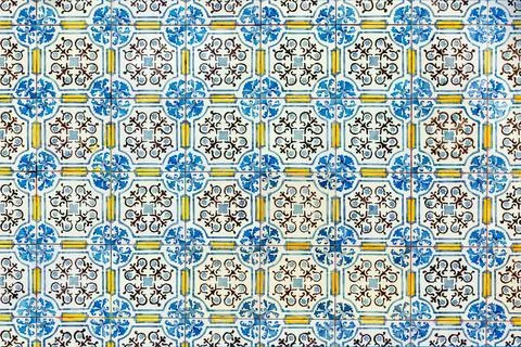 Pattern of typical old decorated tiles at a wall in Portugal Stock Photos
