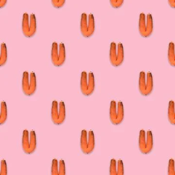 Pattern with ugly carrot on the pink background. Stock Illustration