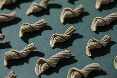 Pattern of uncooked curvy pasta Stock Photos