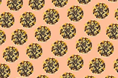 Pattern of vegan pizzas on background of color of the year peach fuzz. 写真素材