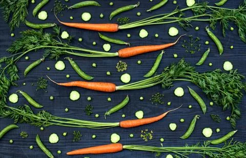 Pattern from vegetables on a black wooden background Stock Photos