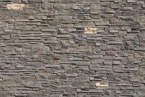 Pattern wall from decorative stones Stock Photos