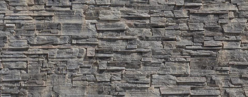 Pattern wall from decorative stones Stock Photos