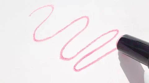 A pattern with wavy lines of red lipstick on a white background, the shadow o Stock Photos