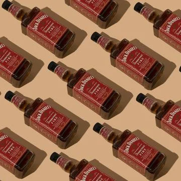 Pattern whiskey bottle Jack Daniels Red label background. Jennessee fire Stock Photos