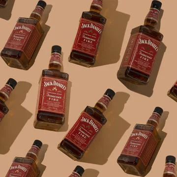 Pattern whiskey bottle Jack Daniels Red label background. Jennessee fire Stock Photos