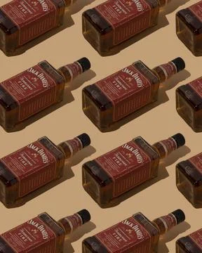 Pattern whiskey bottle Jack Daniels Red label background. Jennessee fire Stock Photos