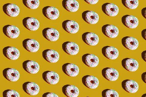 A pattern of white and black doughnuts. food pattern background texture splas Stock Photos