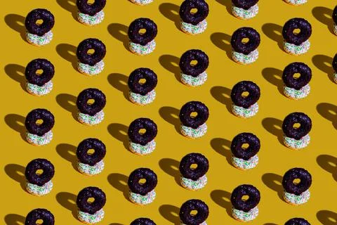 A pattern of white and black doughnuts. food pattern background texture splas Stock Photos