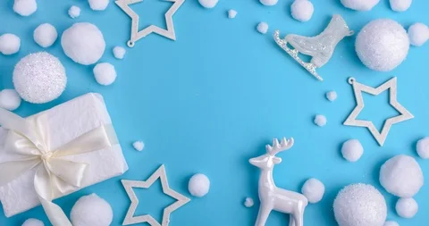 Pattern white Christmas decorations, gifts and snow on a blue background. Stock Footage 121328610